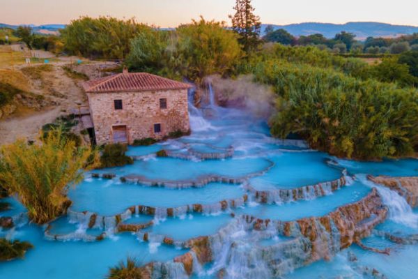 natural spa with waterfalls and hot springs at Saturnia thermal baths, Grosseto, Tuscany, Italy,Hot springs Cascate del Mulino with old watermill, Saturnia, Grosseto, Tuscany, Italy. High quality photo